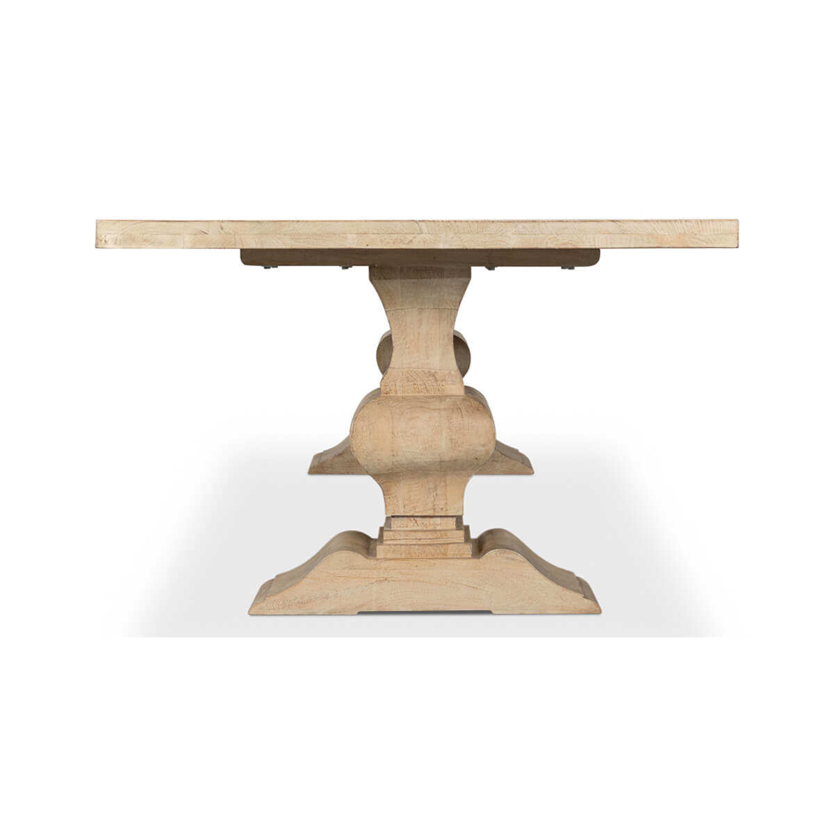 Dining table end view highlighting base shape and structure.