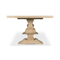 Dining table end view highlighting base shape and structure.