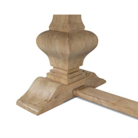 Detailed view of table base with ornate support design.