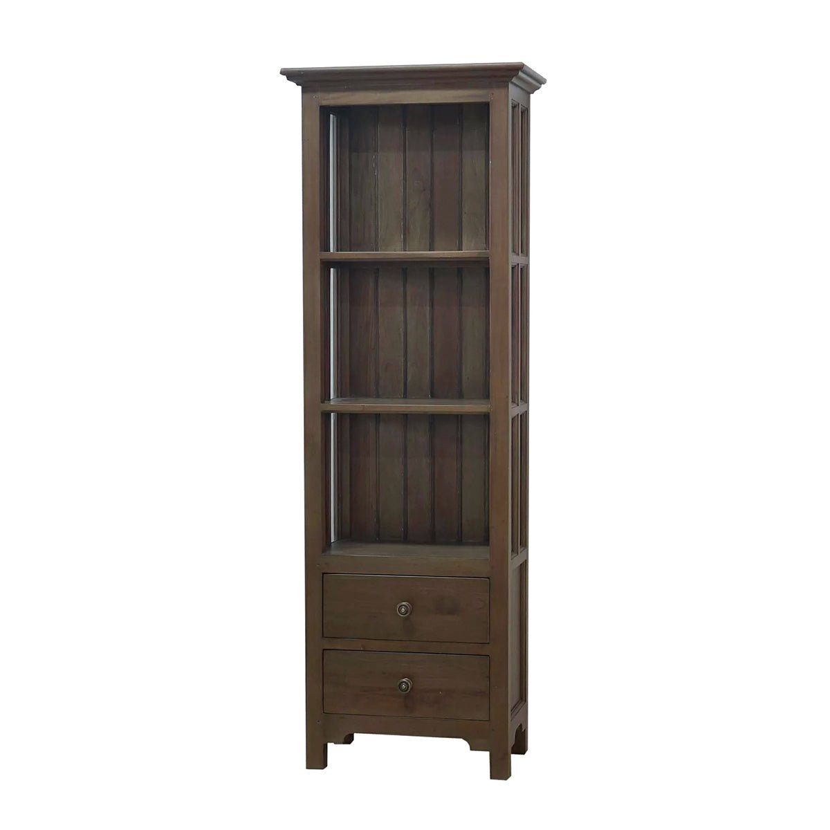 Tall wooden bookcase with closed drawers, white background.