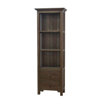 Tall wooden bookcase with closed drawers, white background.