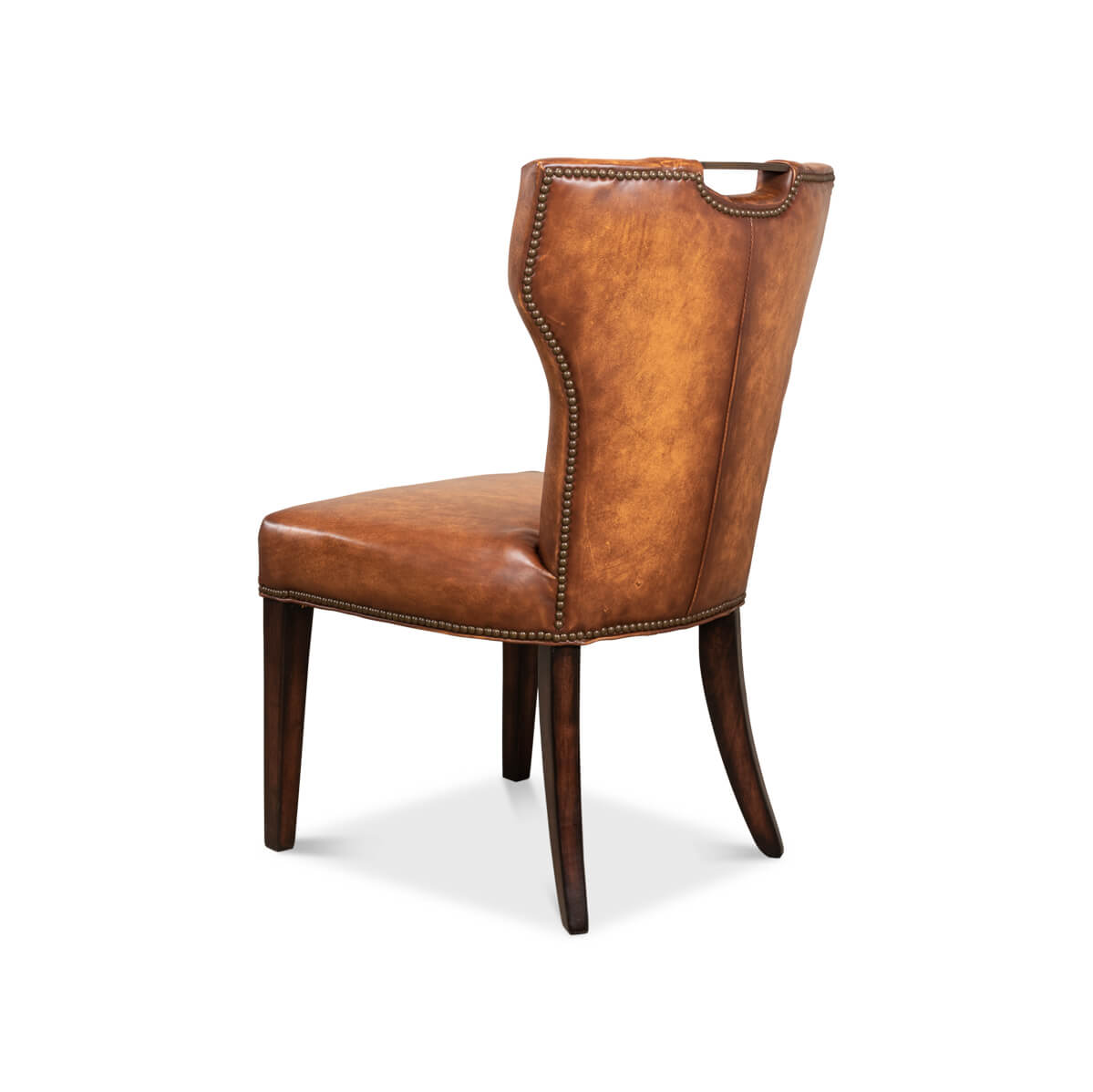 Cognac leather dining chair angled rear view, wooden legs.