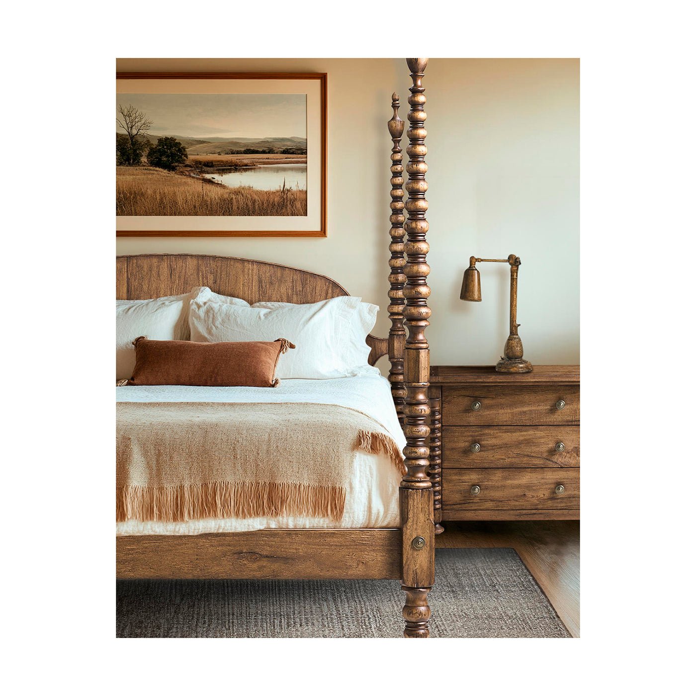 Wooden bed with white bedding, landscape artwork above.