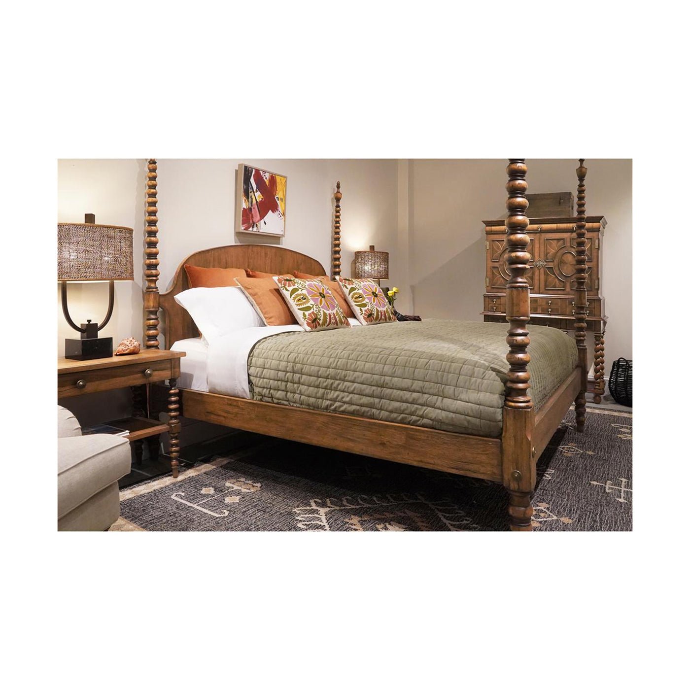 Rustic bed in cozy room, green bedding, lamps.