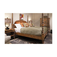 Rustic bed in cozy room, green bedding, lamps.