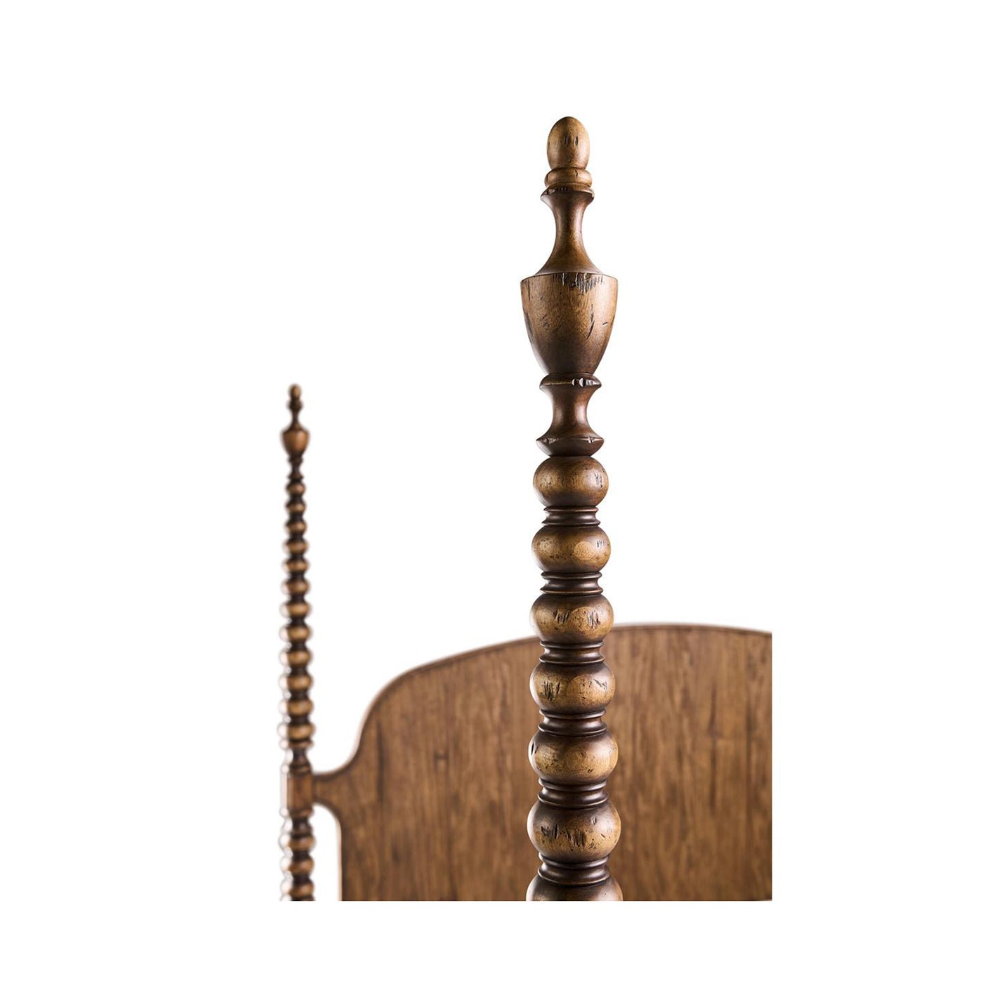 Close-up of wooden bedpost with intricate turning design.
