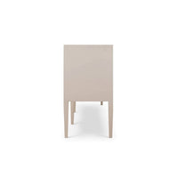 Side view of cream linen sideboard, sleek design, legs visible.