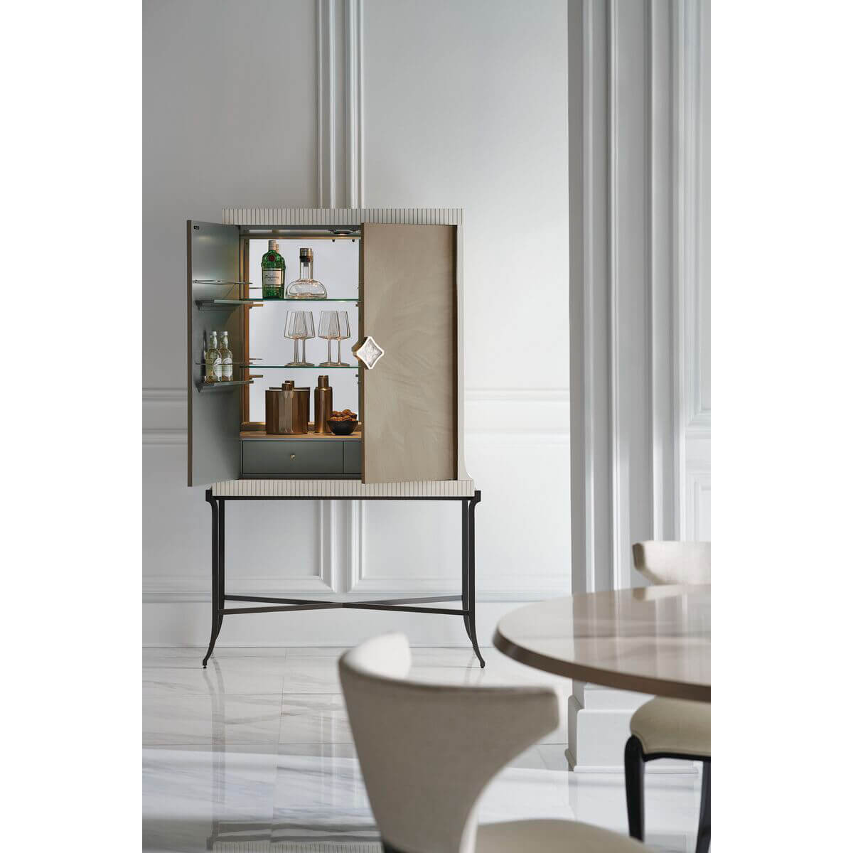 Open contemporary bar cabinet displaying glassware and bottles.