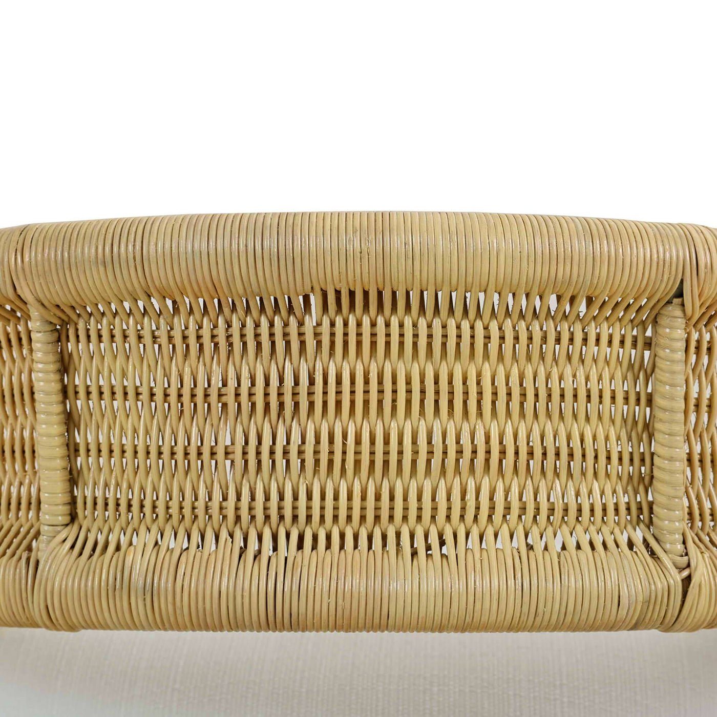 Rattan barrel dining chair weaving close-up.