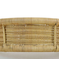 Rattan barrel dining chair weaving close-up.