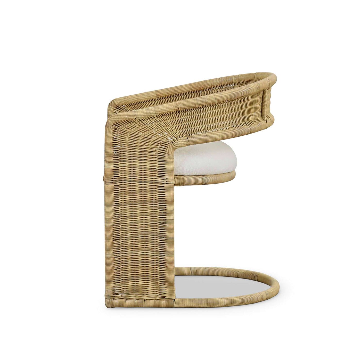 Rattan barrel dining chair side profile.