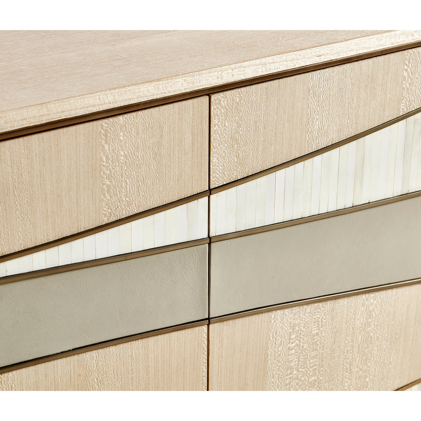 Close-up wave pattern on contemporary coastal sideboard doors.