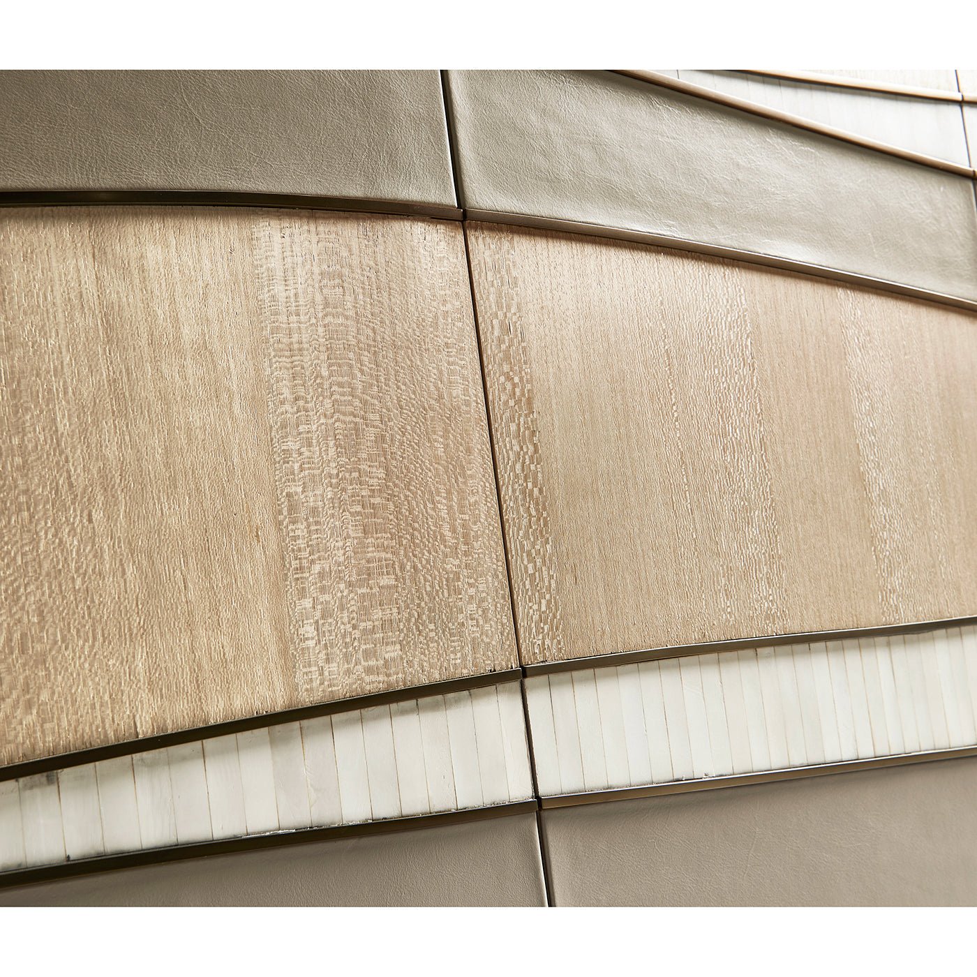 Texture detail on contemporary coastal sideboard door close-up.