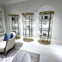 Trio of half-moon etageres with modern decor.