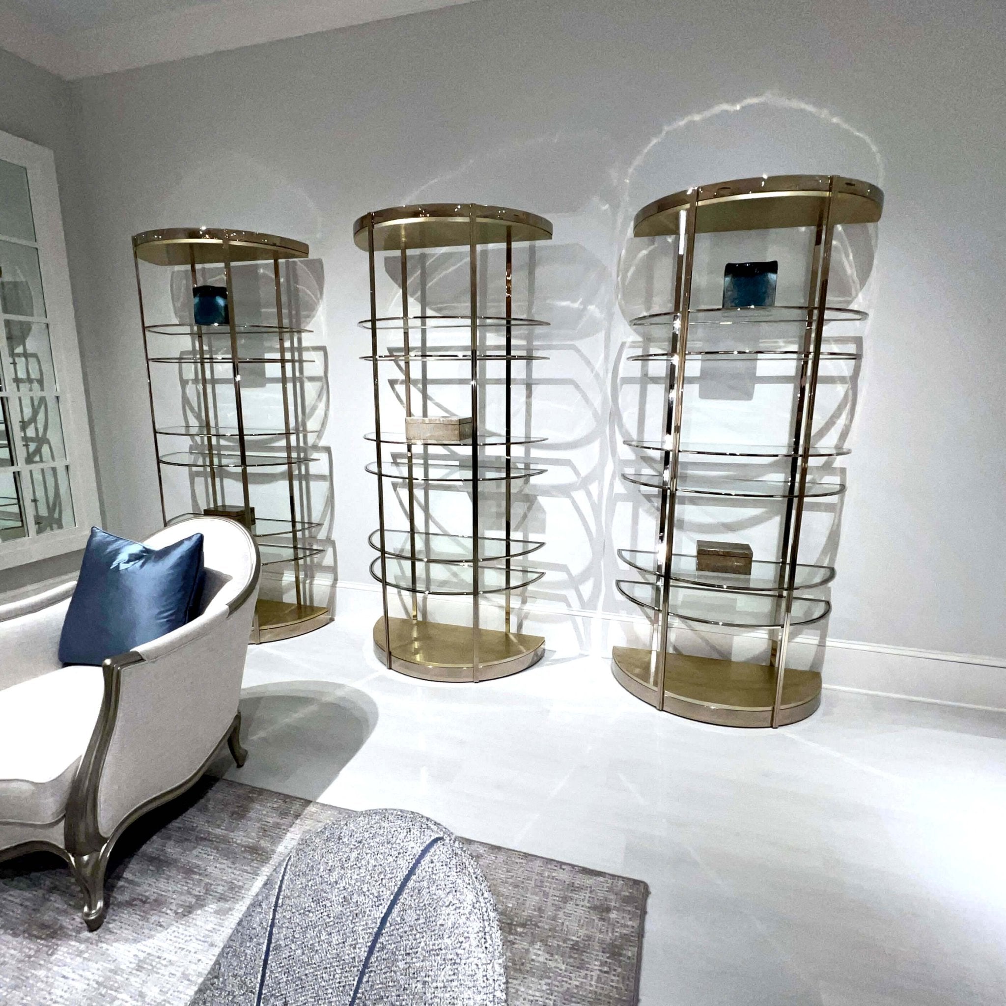 Trio of half-moon etageres with modern decor.