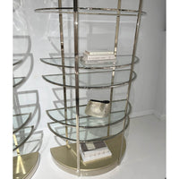 Etagere displaying books and accessories, close-up view.
