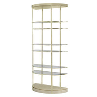 Brass half-moon etagere with glass shelves.