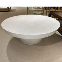 Contemporary round coffee table, top view, showroom setting.