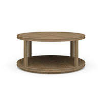 Round wooden coffee table, front perspective.