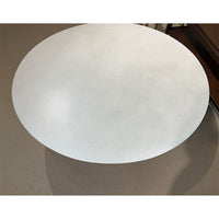 Contemporary round coffee table, close-up of tabletop surface.