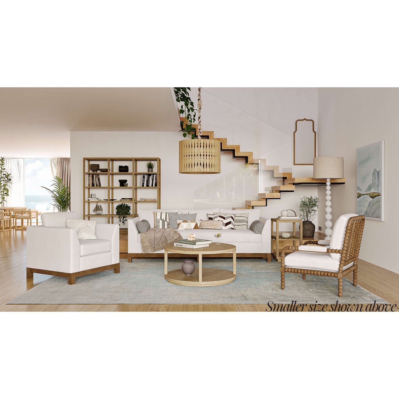Styled living room featuring round coffee table centerpiece.