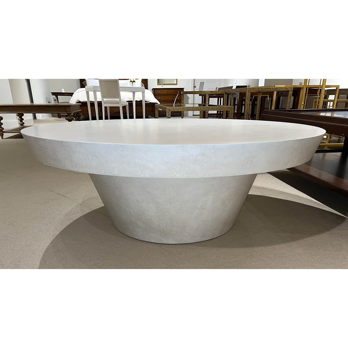 Contemporary round coffee table, perspective angle, minimalistic design.