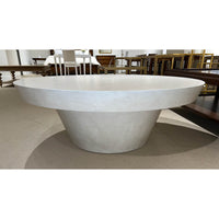 Contemporary round coffee table, perspective angle, minimalistic design.