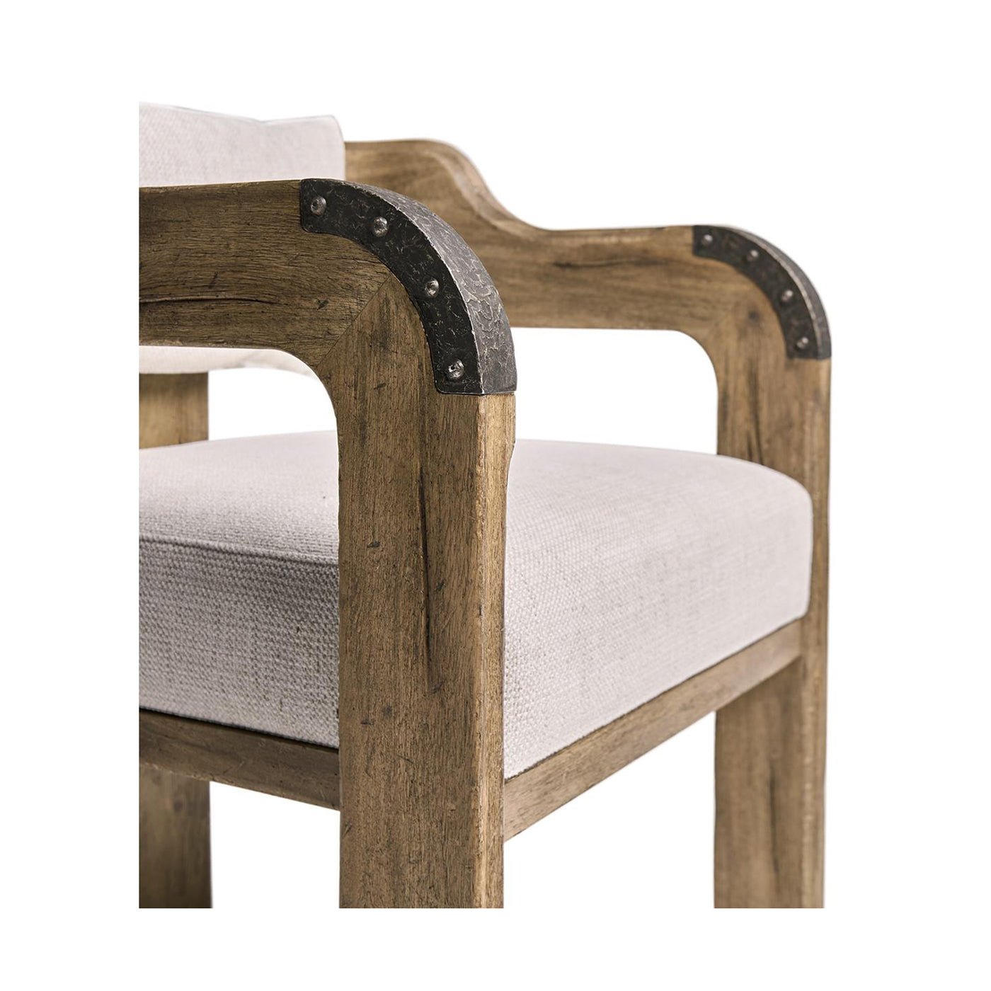 Chair arm close-up with metal accents, rustic design.