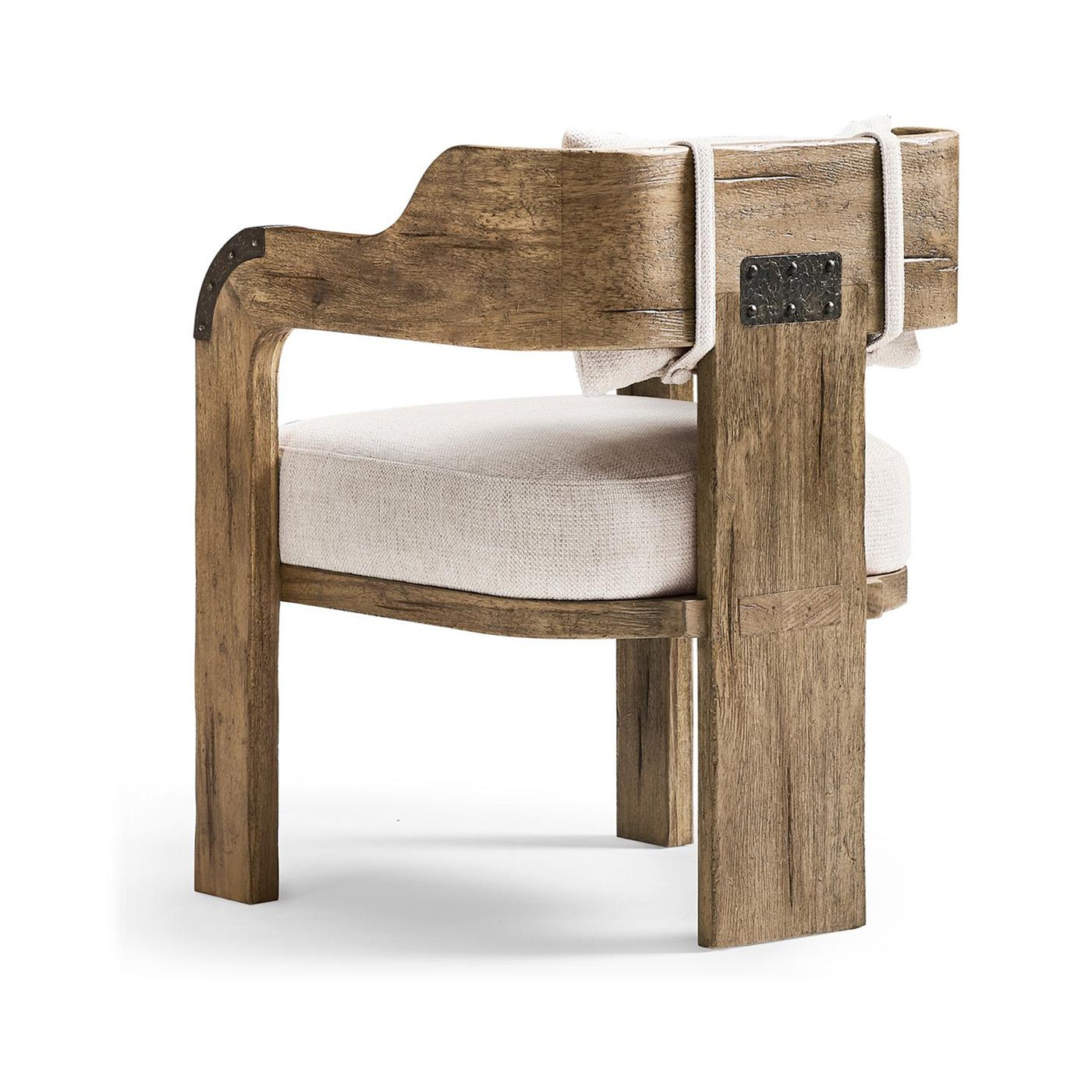 Side view of armchair highlighting metal accents and upholstery.
