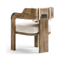 Side view of armchair highlighting metal accents and upholstery.