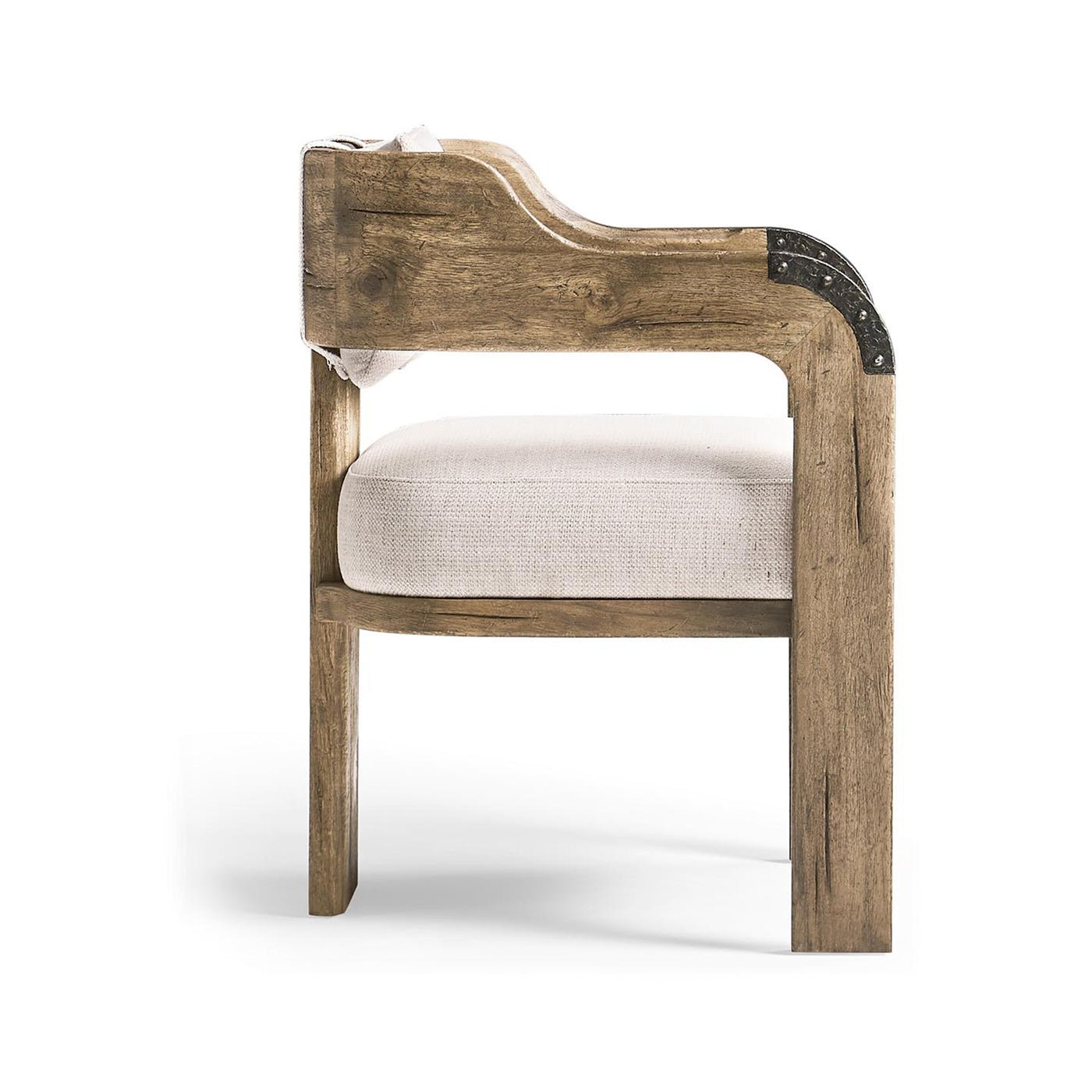 Side view of wooden armchair with plush seating.