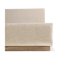 Close-up of contemporary upholstered CAL King bed's corner.
