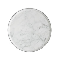 White marble tabletop, circular, overhead view.