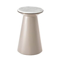 Tan accent table with marble top, side view.