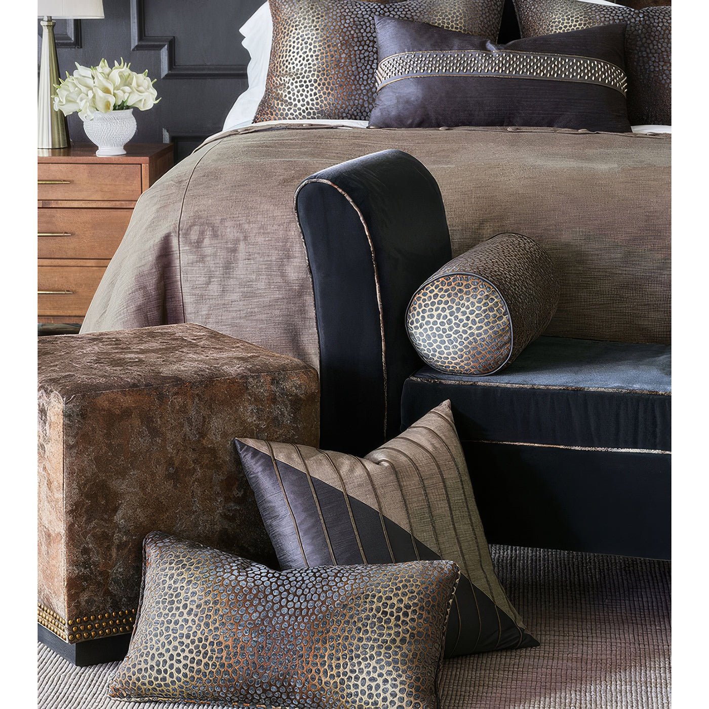 Copper velvet ottoman in a modern bedroom setting.