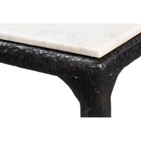 Close-up of dining table leg, hammered texture visible.