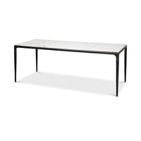Marble dining table, angled view, black legs visible.