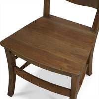 Top view of wooden ladder back chair's seat.