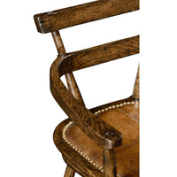 Close-up of bar stool's wooden armrest and leather seat.