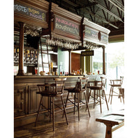 Cozy pub setting with oak bar stools at the counter.