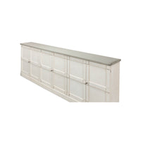 Angled view of white sideboard, gray top corner.