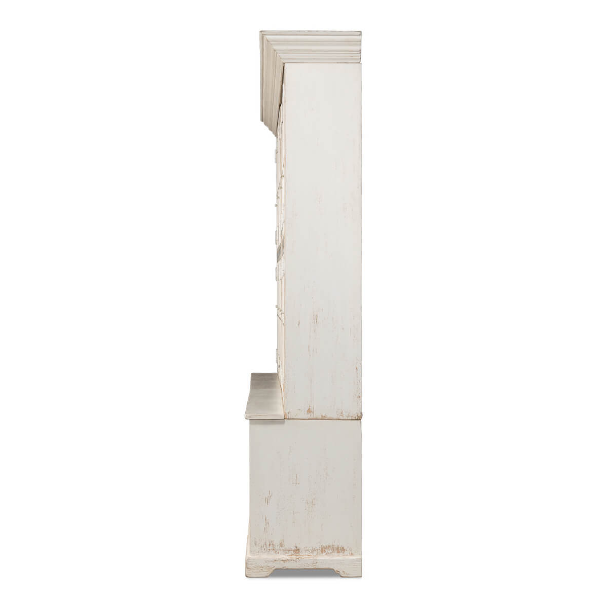 Side profile of tall white bookcase.
