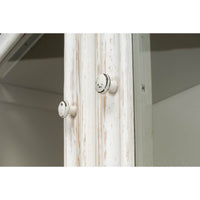 Close-up knobs on display cabinet, distressed white wood.