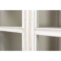 Glass panel detail on distressed white display cabinet.