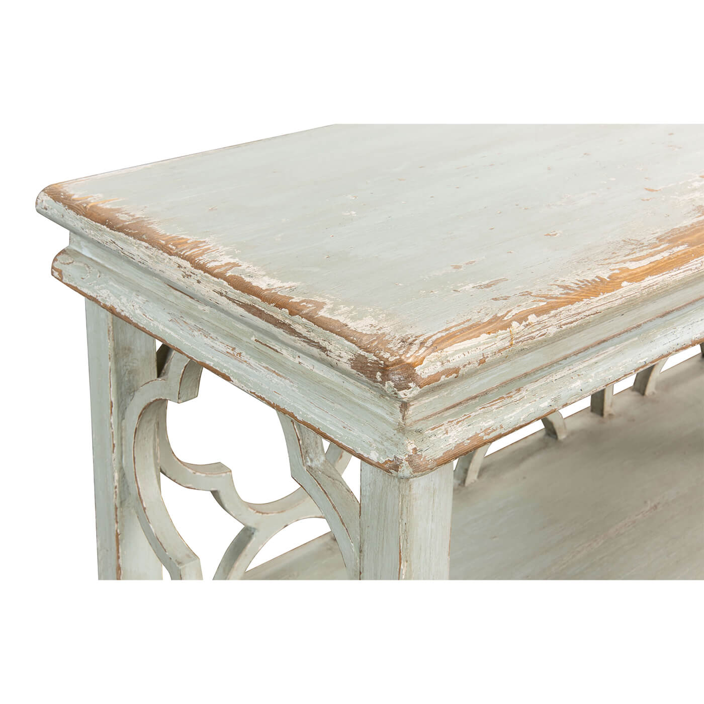 Close-up corner detail of country painted quatrefoil bookcase.