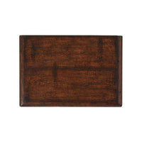 Top view of rustic oak bedside table surface.