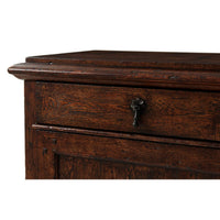 Close-up of drawer handle on rustic bedside table.