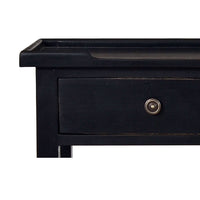 Close-up of black console table drawer handle.