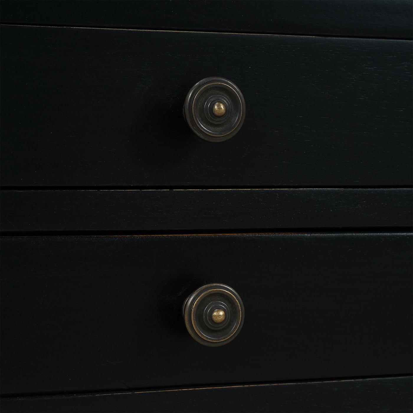 Close-up of black side table drawer knobs.