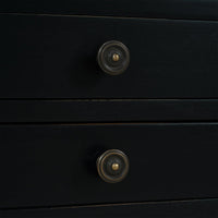 Close-up of black side table drawer knobs.